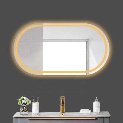 Smart LED-Badezimmer-Spiegel mit ovaler Badtoilette und leuchtenden Lichtern in Silber
